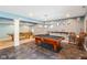 Basement with a pool table, ping pong table, and light gray walls at 11061 Mast Ct, Fishers, IN 46040