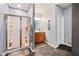 Bathroom featuring a glass-enclosed shower, single sink vanity, and neutral color scheme at 11061 Mast Ct, Fishers, IN 46040