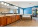 This bathroom features a soaking tub, double vanity, and private commode at 11061 Mast Ct, Fishers, IN 46040