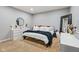 Bedroom with gray walls, carpet, white bedding with patterned throw, and white dresser at 11061 Mast Ct, Fishers, IN 46040