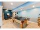 Basement game room with a ping pong table and exercise bike at 11061 Mast Ct, Fishers, IN 46040