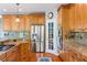 Gourmet kitchen features granite countertops, stainless steel appliances and custom wood cabinetry at 11061 Mast Ct, Fishers, IN 46040