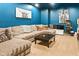 Comfortable living room with a large sectional sofa, black coffee table, and a popcorn machine at 11061 Mast Ct, Fishers, IN 46040