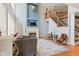 Inviting living room with a fireplace, high ceilings, staircase and comfortable seating, perfect for relaxation at 11061 Mast Ct, Fishers, IN 46040
