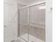 Tiled bathroom featuring a sliding glass shower door at 1108 Bevy Blvd, Danville, IN 46122