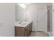 Well-lit bathroom with double sink vanity, stylish mirrors, and a walk-in shower at 1108 Bevy Blvd, Danville, IN 46122