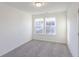 Bedroom with neutral carpeting and two windows at 1108 Bevy Blvd, Danville, IN 46122