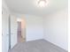 Bedroom with neutral carpeting with view to hallway at 1108 Bevy Blvd, Danville, IN 46122