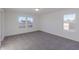 Bright and spacious bedroom featuring soft carpet, neutral walls, and large windows for natural light at 1108 Bevy Blvd, Danville, IN 46122