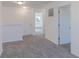 Hallway with neutral carpeting, doors, and ceiling lights at 1108 Bevy Blvd, Danville, IN 46122