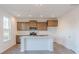 Modern kitchen featuring a central island, sleek countertops, and stainless steel appliances at 1108 Bevy Blvd, Danville, IN 46122