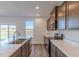 Close-up of kitchen with marble countertops, stainless steel appliances, and convenient island at 1108 Bevy Blvd, Danville, IN 46122