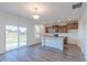 Well-lit kitchen with stainless appliances, central island, and sliding doors for easy outdoor access at 1108 Bevy Blvd, Danville, IN 46122