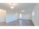 Open-concept living room featuring neutral walls, wood-look floors, and plenty of natural light at 1108 Bevy Blvd, Danville, IN 46122