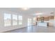 Open living space leads to a kitchen with an island and lots of windows providing natural light at 1108 Bevy Blvd, Danville, IN 46122