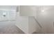 Bright staircase leading to a carpeted upper level, showcasing a clean and modern design at 1108 Bevy Blvd, Danville, IN 46122