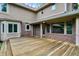 Spacious wooden deck overlooking the lush backyard and brickwork of this beautiful home at 11469 Woodview Ct, Fishers, IN 46038