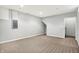 Unfinished basement featuring neutral carpet and light gray walls, ideal for various uses at 11469 Woodview Ct, Fishers, IN 46038