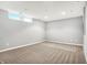 Spacious basement featuring neutral carpet and light gray walls, offering a blank canvas for your design at 11469 Woodview Ct, Fishers, IN 46038