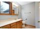 Neutral bathroom featuring wood-framed vanity, toilet, and medicine cabinet at 11469 Woodview Ct, Fishers, IN 46038