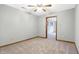Spacious bedroom with plush carpeting and doorway, offering a neutral palette at 11469 Woodview Ct, Fishers, IN 46038