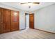 Bedroom features a large closet and plush carpeting, with a doorway leading to another room at 11469 Woodview Ct, Fishers, IN 46038