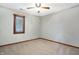 Carpeted bedroom with a window and neutral wall paint, offering comfort and simplicity at 11469 Woodview Ct, Fishers, IN 46038