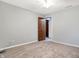 A cozy bedroom featuring neutral paint, plush carpet, and a ceiling fan at 11469 Woodview Ct, Fishers, IN 46038
