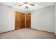 Bedroom features a closet and plush carpeting, enhancing its comfort and neutral aesthetic at 11469 Woodview Ct, Fishers, IN 46038
