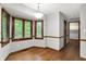 Dining nook featuring hardwood floors, chandelier lighting, and large bay windows at 11469 Woodview Ct, Fishers, IN 46038