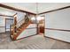 Dining room with trimwork, wooden staircase, and a view to the kitchen at 11469 Woodview Ct, Fishers, IN 46038