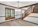 Dining room with traditional trim and a staircase with wooden banister at 11469 Woodview Ct, Fishers, IN 46038