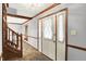 Inviting foyer with a front door with sheer curtains, a staircase, and neutral paint at 11469 Woodview Ct, Fishers, IN 46038