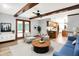 Open-concept living space with stylish decor, hardwood floors, and seamless flow to the kitchen at 11469 Woodview Ct, Fishers, IN 46038