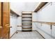 Well-organized walk-in closet with ample shelving and hanging space at 11469 Woodview Ct, Fishers, IN 46038
