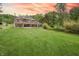 A sprawling backyard offers ample space for recreation and relaxation, complementing the stunning home design at 11911 W Grandview Dr, Columbus, IN 47201