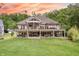 Expansive backyard view showcases a multi-level deck perfect for outdoor entertaining and relaxation at 11911 W Grandview Dr, Columbus, IN 47201
