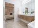 Bathroom with a double sink vanity with modern fixtures, and a view to the main bedroom, creating a serene space at 11911 W Grandview Dr, Columbus, IN 47201
