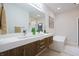 Bright bathroom with a double sink vanity, modern fixtures, and a luxurious soaking tub for ultimate relaxation at 11911 W Grandview Dr, Columbus, IN 47201