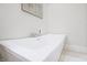 Modern white bathtub with sleek chrome fixtures offering a relaxing space for a luxurious home bathing experience at 11911 W Grandview Dr, Columbus, IN 47201