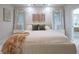 Serene bedroom with a plush bed, stylish decor, and view to the bathroom creating a peaceful retreat at 11911 W Grandview Dr, Columbus, IN 47201