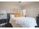 Bright bedroom with plush bedding, dark accents, and inviting ambiance at 11911 W Grandview Dr, Columbus, IN 47201