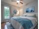 Serene bedroom with a cozy bed, bright window, and soothing decor at 11911 W Grandview Dr, Columbus, IN 47201
