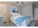 Serene bedroom with comfortable bed, accent art, and hardwood floors at 11911 W Grandview Dr, Columbus, IN 47201