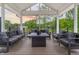 Inviting covered outdoor deck features contemporary seating and sunset views at 11911 W Grandview Dr, Columbus, IN 47201