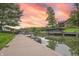 A private dock with boat access and a beautiful sunset is ideal for waterfront living and recreation at 11911 W Grandview Dr, Columbus, IN 47201