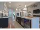 Open-concept kitchen with modern white cabinets and stainless steel appliances at 11911 W Grandview Dr, Columbus, IN 47201