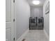 Laundry room with front load washer and dryer and gray storage cabinets at 11911 W Grandview Dr, Columbus, IN 47201