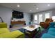Welcoming living room featuring modern furniture, recessed lighting, and large TV at 11911 W Grandview Dr, Columbus, IN 47201