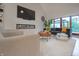 Inviting living room features a linear fireplace, large TV, stylish seating, and bright outdoor view at 11911 W Grandview Dr, Columbus, IN 47201